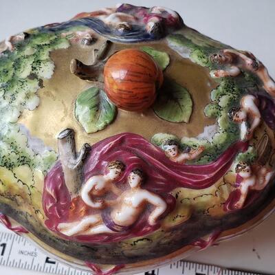 Small Capodimonte bowl with Lid, carvings of figures and babies