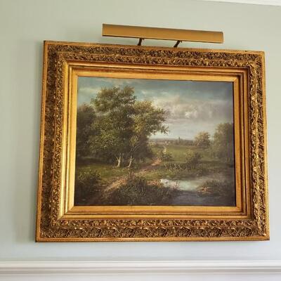 Painting, ornate frame with attached light
