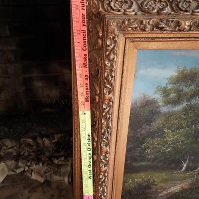 Painting, ornate frame with attached light