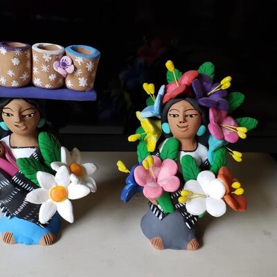 Shop girls, signed clay figures