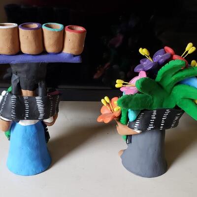 Shop girls, signed clay figures