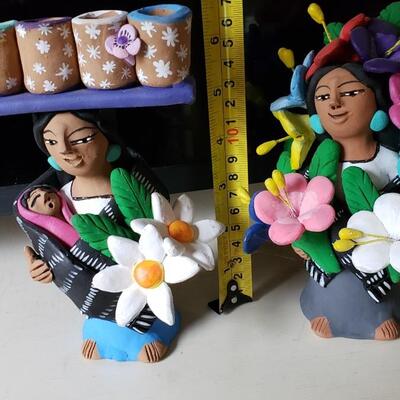 Shop girls, signed clay figures