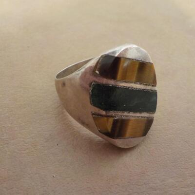 Sterling silver men's ring with precious stone inlay.