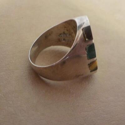 Sterling silver men's ring with precious stone inlay.