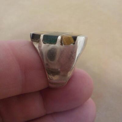 Sterling silver men's ring with precious stone inlay.