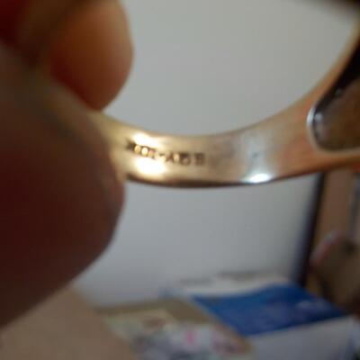 10 K gold base and sterling silver design top ring.