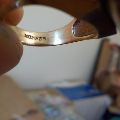 10 K gold base and sterling silver design top ring.