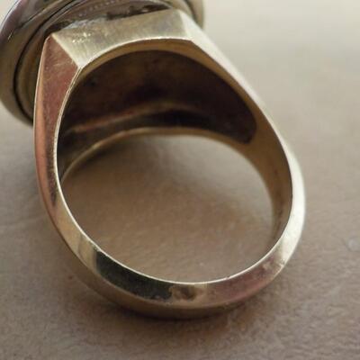 10 K gold base and sterling silver design top ring.