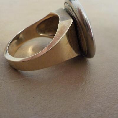 10 K gold base and sterling silver design top ring.