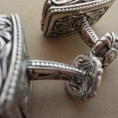Men's Sterling "Dude" cuff links artistic design.