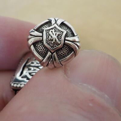 Men's Sterling "Dude" cuff links artistic design.