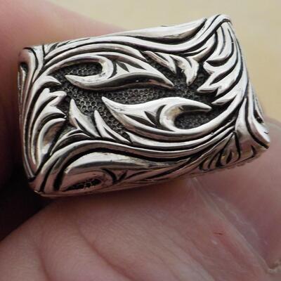 Men's Sterling "Dude" cuff links artistic design.