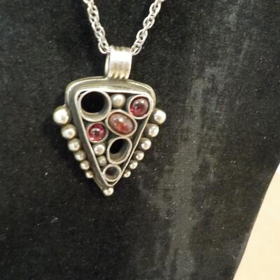 Totally Art Deco sterling silver necklace with precious stones.
