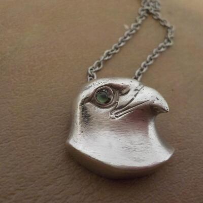 Stunning sterling silver Falcon with eye stone. Necklace.