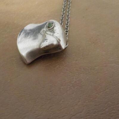 Stunning sterling silver Falcon with eye stone. Necklace.