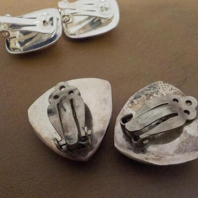 2 Pair of clip on sterling silver ear rings.