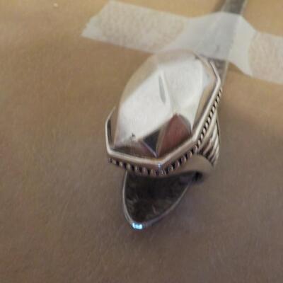 Sterling silver artistic design.
