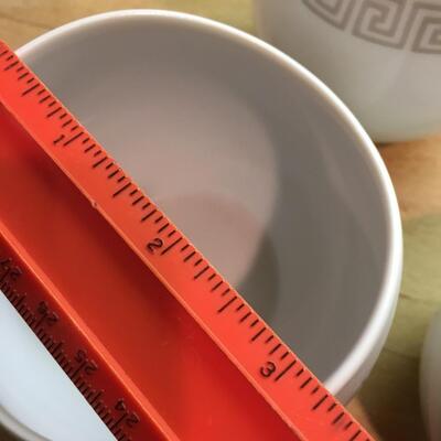 Pair of sugar bowls and pitchers