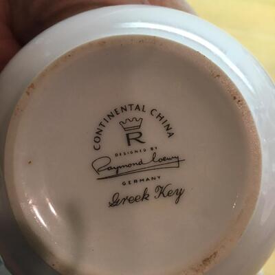 Pair of sugar bowls and pitchers