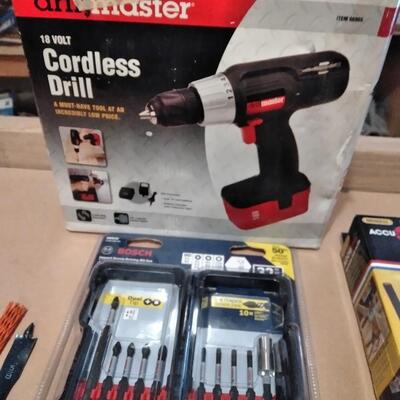 LOT 214 DRILL MASTER CORDLESS DRILL WITH BITS AND DRILL GUIDE
