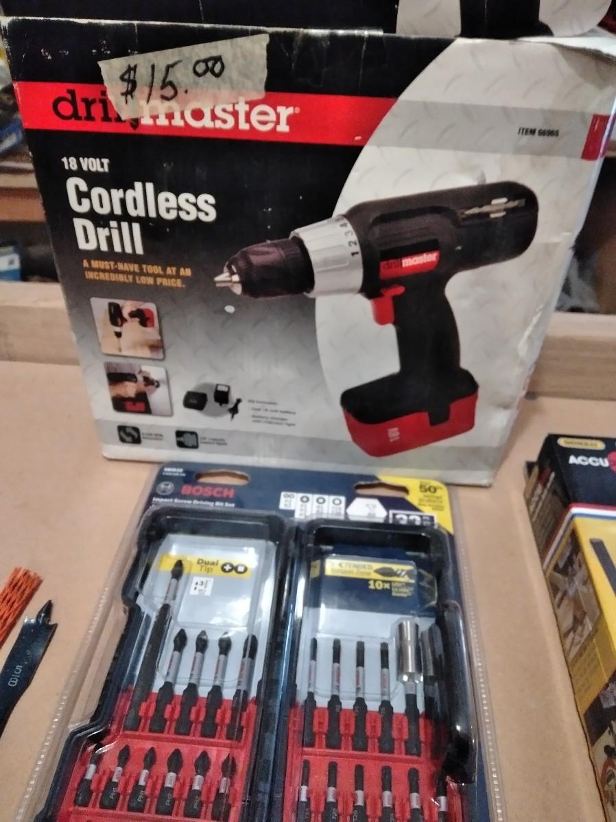 LOT 214 DRILL MASTER CORDLESS DRILL WITH BITS AND DRILL GUIDE