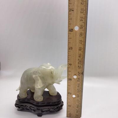 Lot 11 - Carved Green Stone Elephant with stand