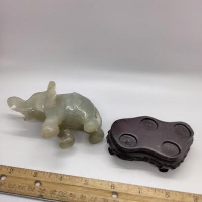 Lot 11 - Carved Green Stone Elephant with stand