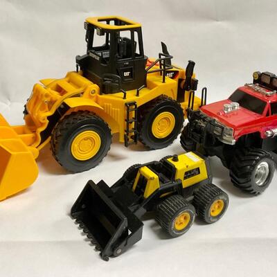 Three Piece Lot of Construction Vehicles Bulldozers Monster Truck
