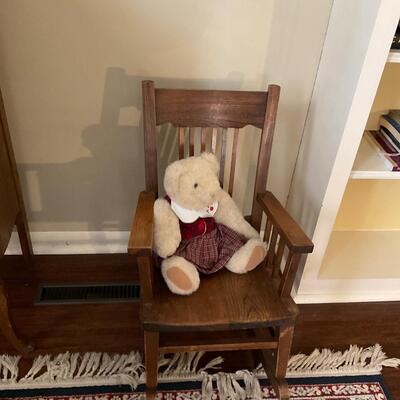 Child’s wooden rocking chair with bear