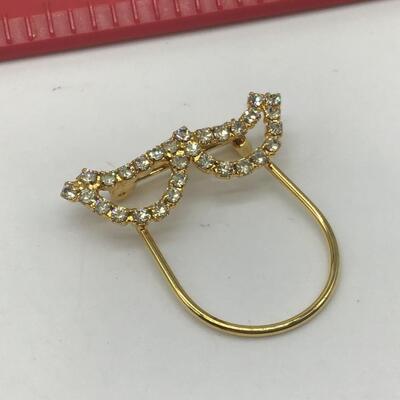 Gold tone brooch with faux Diamonds