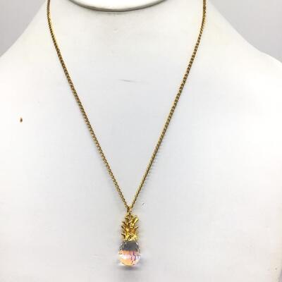 Gold tone necklace with crystal pendant