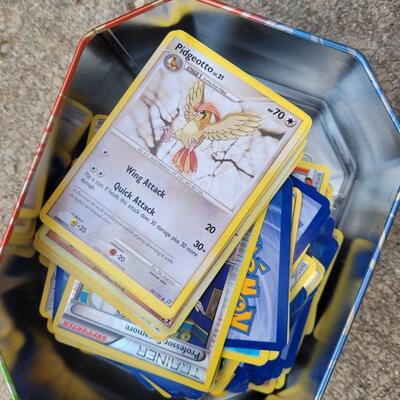 Pokemon Cards- 4 tins full!
