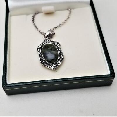 Lot #2  Sterling Silver Madonna Medal with moss green cabochon on reverse