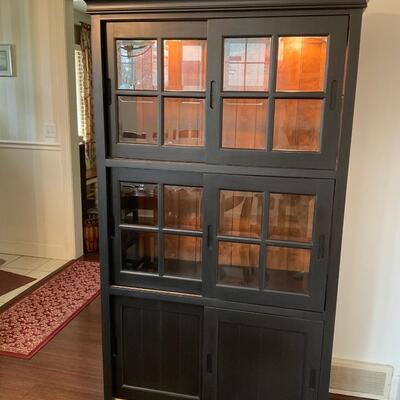 Black Lighted curio cabinet with sliding doors