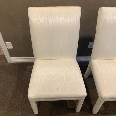 #115 Two Silky White Chairs.