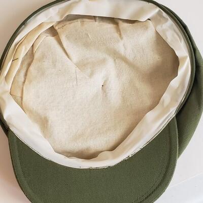 Vintage green hat or cap with pins