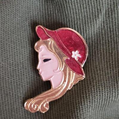 Vintage green hat or cap with pins