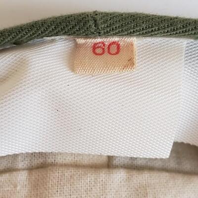 Vintage green hat or cap with pins