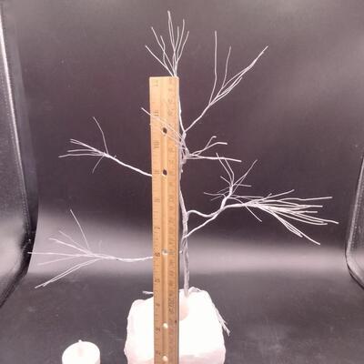 Lot 143 - Wire tree on rose quartz candle holder
