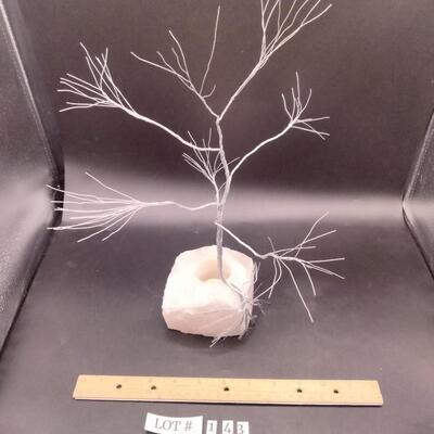Lot 143 - Wire tree on rose quartz candle holder