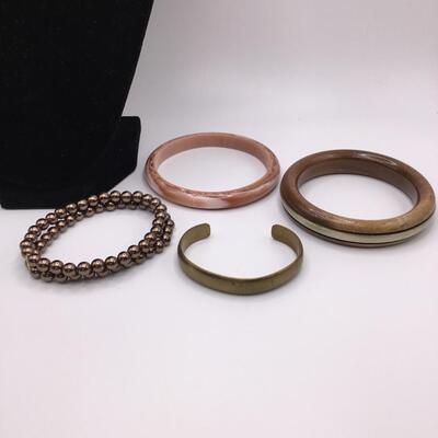LOTJ158: Four Costume Bracelets - Metal, Wood, Plastic