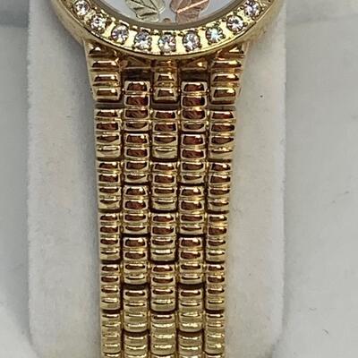 LOT 78R: 12K Gold Leaves Black Hills Woman's Watch w/Inlay Crystal Face