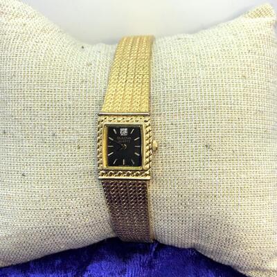 LOT:17: Bulova Gold tone Stainless Steel Black face Quartz Watch