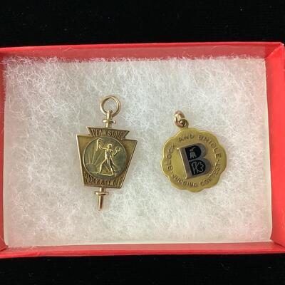 1006 Two 10kt PA. State Block & Bridle Charms