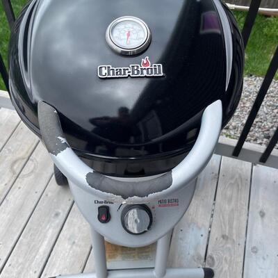 K9 Charbroil grill and 1 propane tanks