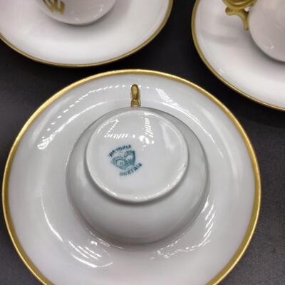 9 - 5 antique demitasse cup and saucers