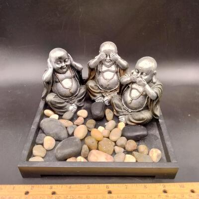 16 - 3 buddha figurines in tray with rocks