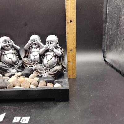16 - 3 buddha figurines in tray with rocks