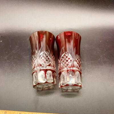 43 - pair vintage ruby to clear cut glass shooters