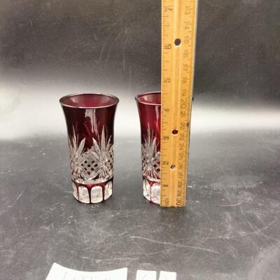 43 - pair vintage ruby to clear cut glass shooters
